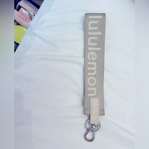 Tan Lululemon white linen key chain wristlet